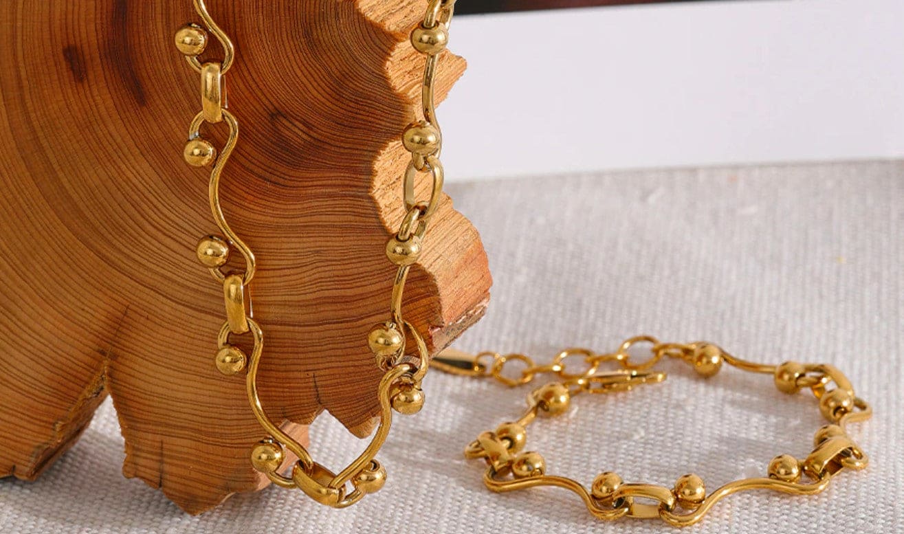 Gold Yvette Ball Chain Necklace on display with jewelry