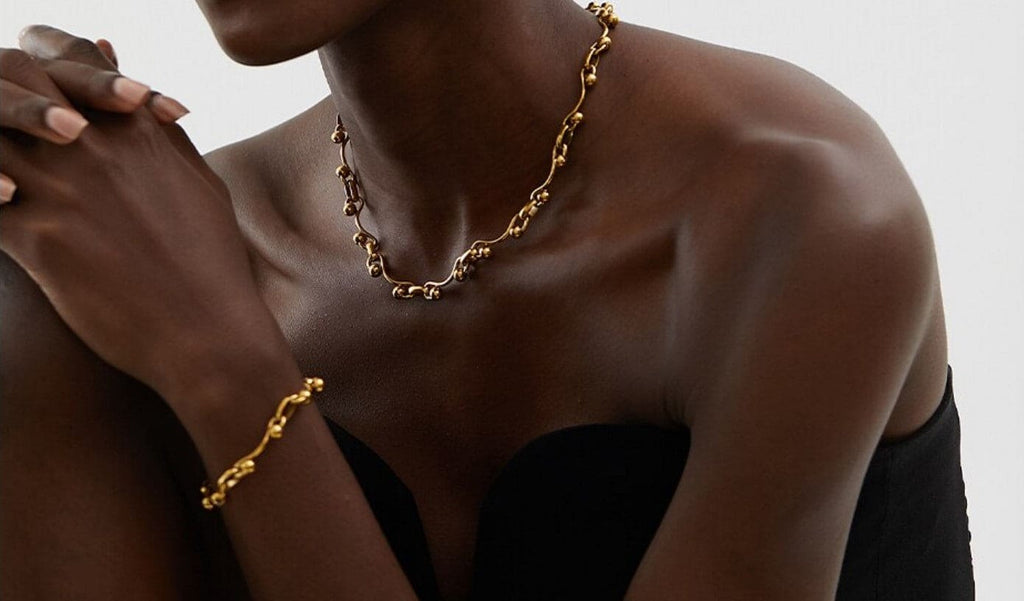 Gold Yvette Ball Chain Necklace showcasing elegant design.