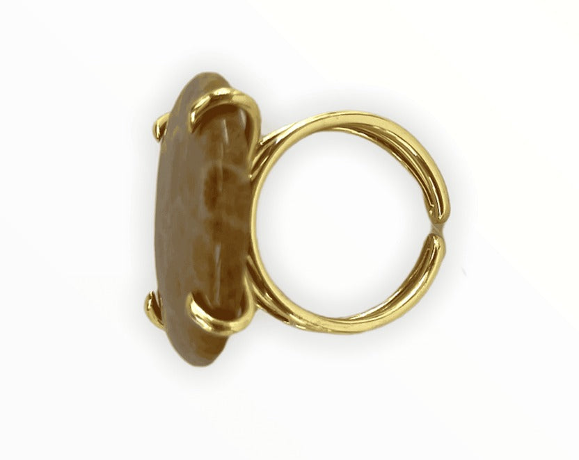 Luxury handcrafted gemstone ring with gold setting, artisan jewelry design.