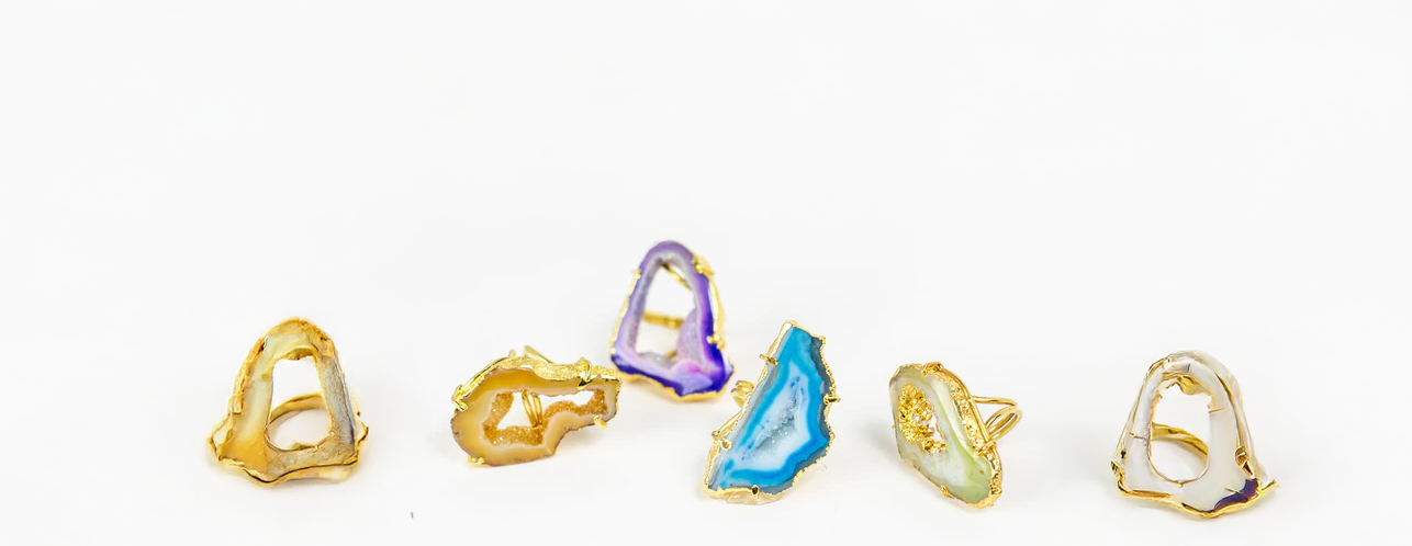 Elegant stackable gemstone rings in various colors, luxury artisan jewelry