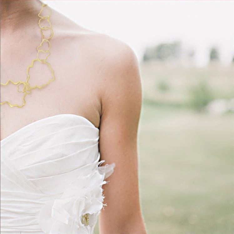 Gold Elegant Dangle Cassie ADMK Earrings worn with a bridal gown.